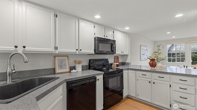 11405 SE 65th St, Bellevue, WA 98006 - kitchen featuring black appliances, a sink, white cabinetry, recessed lighting, and a peninsula
