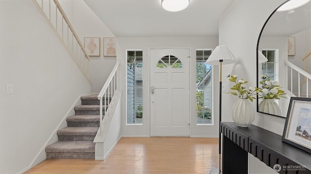 11405 SE 65th St, Bellevue, WA 98006 - entrance foyer with stairway, light wood-style flooring, and baseboards