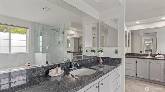 11405 SE 65th St, Bellevue, WA 98006 - full bathroom with a shower stall, two vanities, a garden tub, and recessed lighting