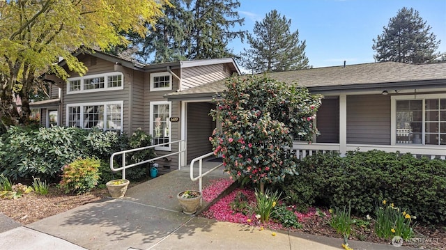 11405 SE 65th St, Bellevue, WA 98006 - view of front of property with an attached garage, concrete driveway, and a shingled roof
