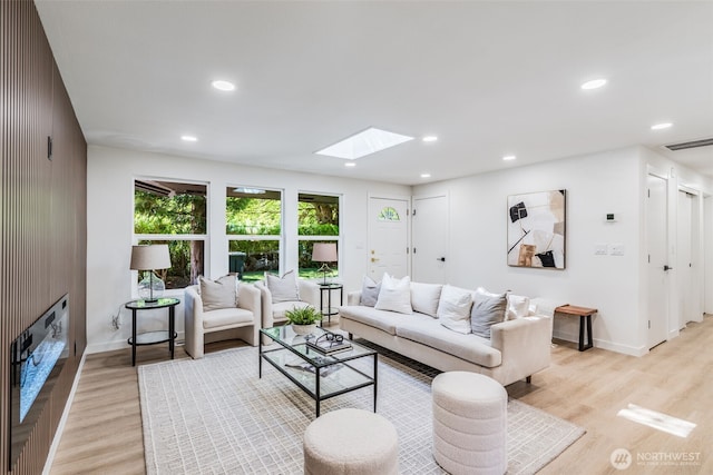 30156 2nd Pl SW, Federal Way, WA 98023 - living area featuring a skylight, light wood-style floors, baseboards, recessed lighting, and a glass covered fireplace