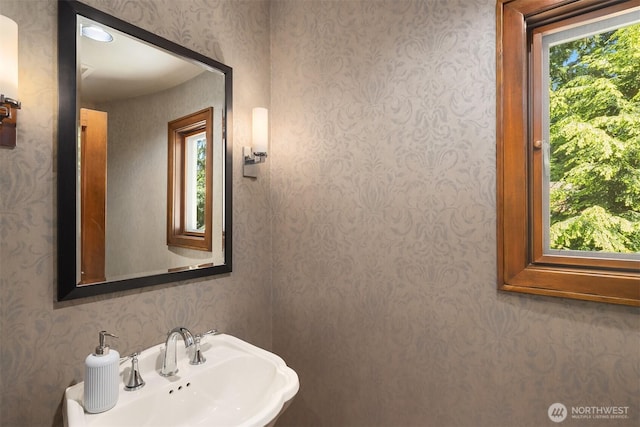 10250 SE 21st St, Bellevue, WA 98004 - half bathroom with a sink and wallpapered walls