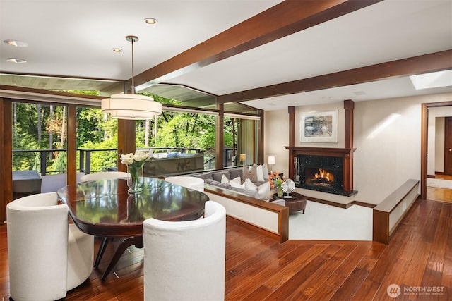 10250 SE 21st St, Bellevue, WA 98004 - dining area featuring wood finished floors, beam ceiling, a fireplace, recessed lighting, and baseboards