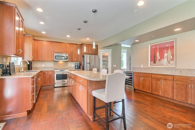 20208 81st Pl NE, Kenmore, WA 98028 - kitchen with stainless steel appliances, beverage cooler, dark wood-type flooring, brown cabinetry, and recessed lighting