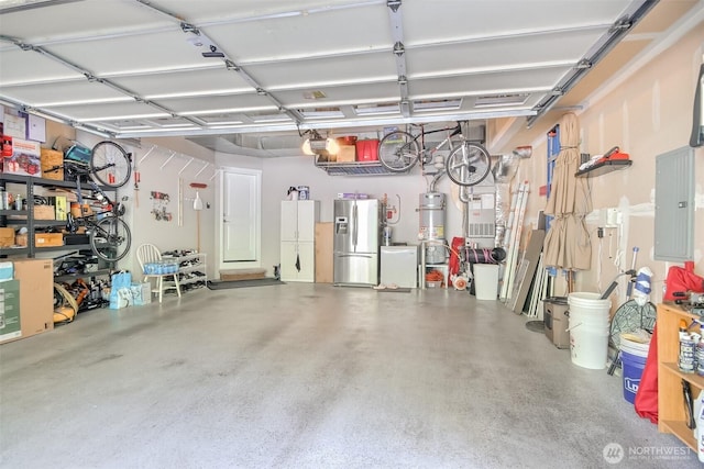 20208 81st Pl NE, Kenmore, WA 98028 - garage featuring stainless steel fridge, electric panel, strapped water heater, and a garage door opener