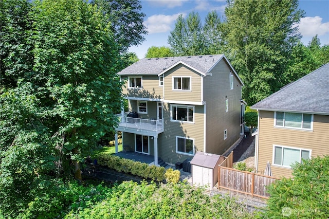 20208 81st Pl NE, Kenmore, WA 98028 - rear view of property with a storage shed, a balcony, and a patio area