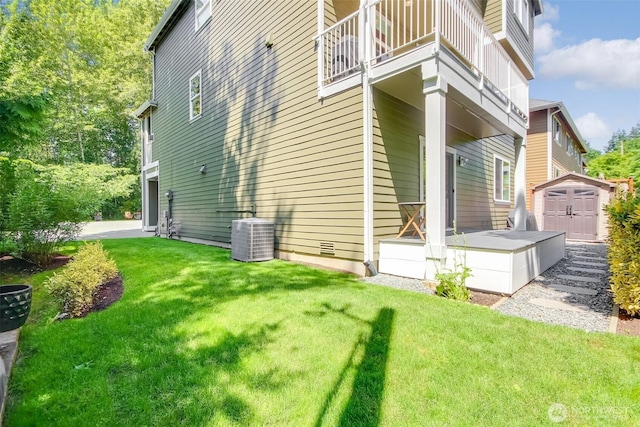 20208 81st Pl NE, Kenmore, WA 98028 - view of side of home featuring a storage unit, a balcony, and a lawn