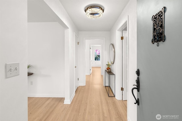 1536 NW 100th St, Seattle, WA 98177 - hallway featuring light wood-style floors, baseboards, and a chandelier