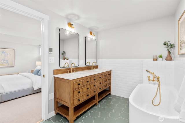 1536 NW 100th St, Seattle, WA 98177 - ensuite bathroom featuring double vanity, a freestanding bath, wainscoting, tile patterned floors, and tile walls