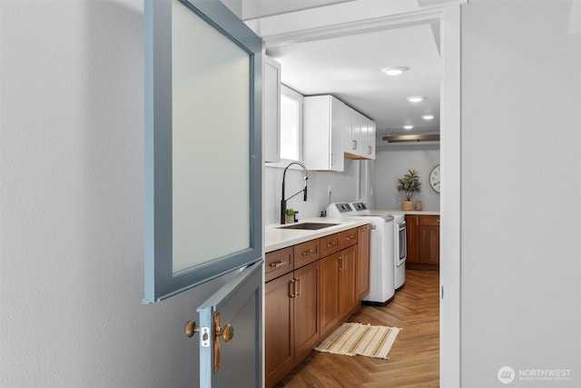 1536 NW 100th St, Seattle, WA 98177 - kitchen with a sink, light countertops, brown cabinetry, and white cabinets