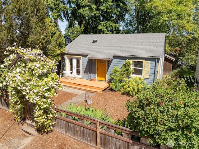 9010 13th Ave SW, Seattle, WA 98106 - view of front facade featuring a wooden deck, a shingled roof, and french doors