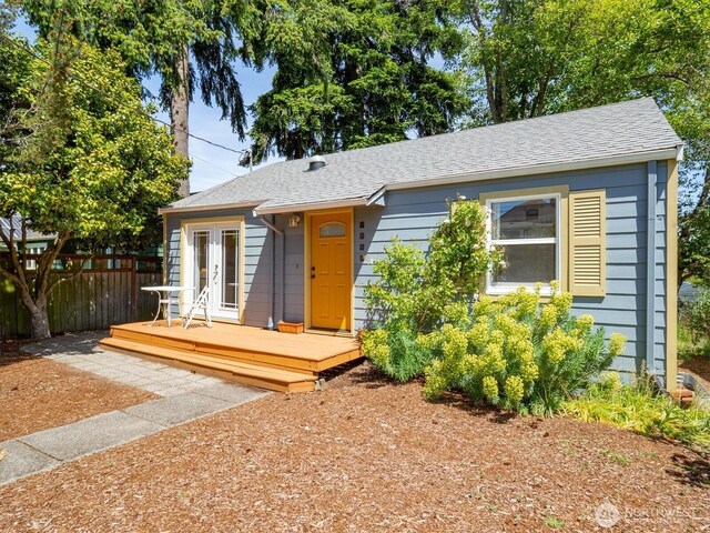 9010 13th Ave SW, Seattle, WA 98106 - view of front facade featuring a wooden deck and roof with shingles