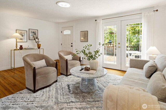 9010 13th Ave SW, Seattle, WA 98106 - living room with french doors, wood finished floors, and baseboards