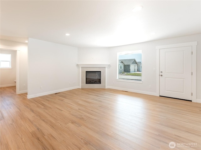 10 Salmon Dr, Wenatchee, WA 98801 - unfurnished living room featuring light wood-type flooring, baseboards, a fireplace, and recessed lighting