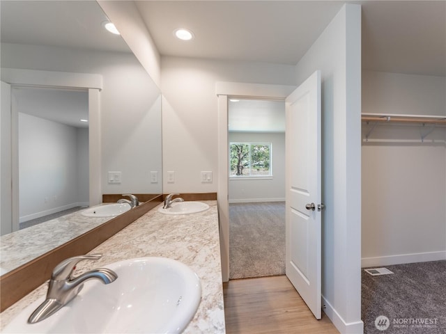 10 Salmon Dr, Wenatchee, WA 98801 - full bathroom with double vanity, recessed lighting, and baseboards