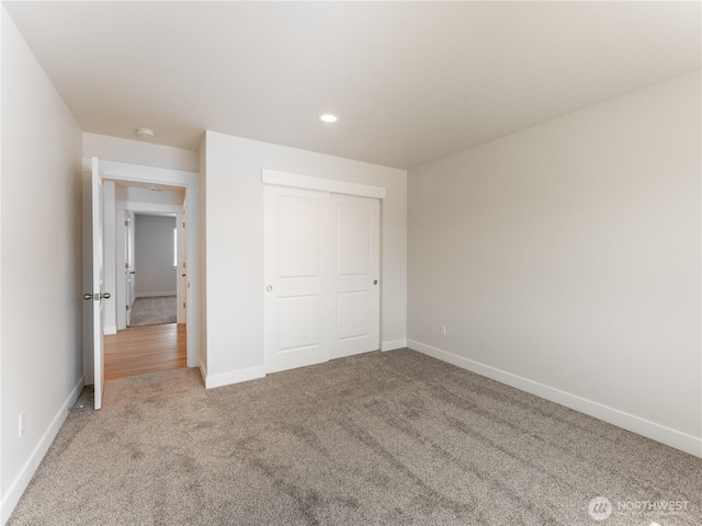 10 Salmon Dr, Wenatchee, WA 98801 - unfurnished bedroom featuring light colored carpet, baseboards, recessed lighting, and a closet