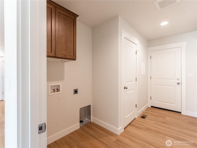 10 Salmon Dr, Wenatchee, WA 98801 - laundry room featuring electric dryer hookup, baseboards, light wood finished floors, hookup for a washing machine, and cabinet space