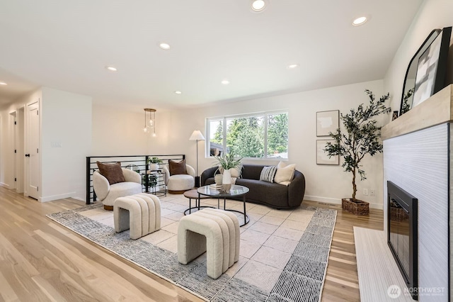 21602 49th Pl W, Mountlake Terrace, WA 98043 - living room with light wood-style flooring, recessed lighting, baseboards, and a fireplace with flush hearth
