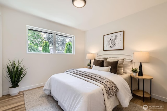 21602 49th Pl W, Mountlake Terrace, WA 98043 - bedroom featuring baseboards and wood finished floors