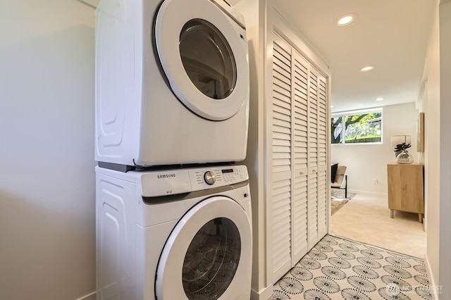 21602 49th Pl W, Mountlake Terrace, WA 98043 - laundry room featuring estacked washer and dryer, recessed lighting, baseboards, and light colored carpet