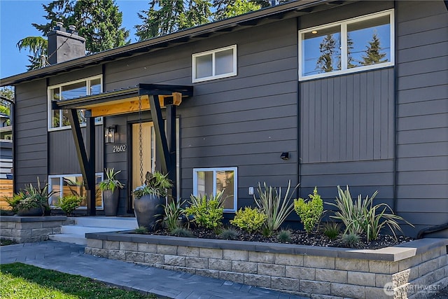 21602 49th Pl W, Mountlake Terrace, WA 98043 - view of exterior entry featuring a chimney