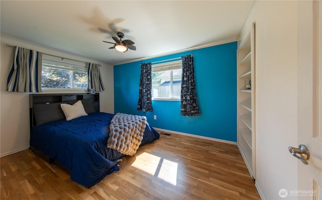 204 76th St SE, Everett, WA 98203 - bedroom with multiple windows, wood finished floors, baseboards, and ornamental molding