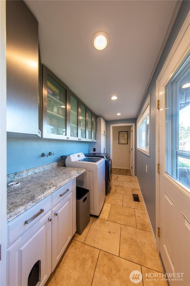 204 76th St SE, Everett, WA 98203 - laundry room with cabinet space, separate washer and dryer, recessed lighting, baseboards, and light tile patterned flooring