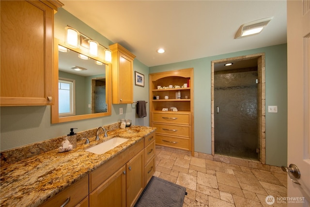 204 76th St SE, Everett, WA 98203 - full bath featuring stone tile floors, vanity, a stall shower, and recessed lighting