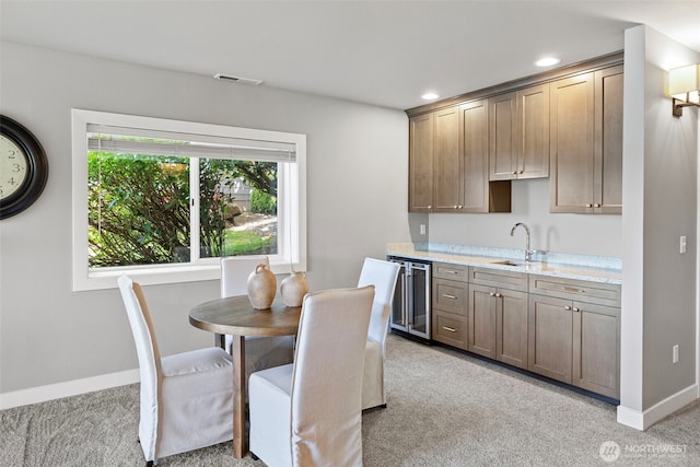 52 Chapman Loop Unit D, Steilacoom, WA 98388 - kitchen with wine cooler, light colored carpet, light countertops, and recessed lighting