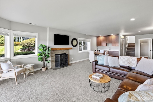 52 Chapman Loop Unit D, Steilacoom, WA 98388 - carpeted living area featuring stairs, baseboards, a fireplace, and recessed lighting