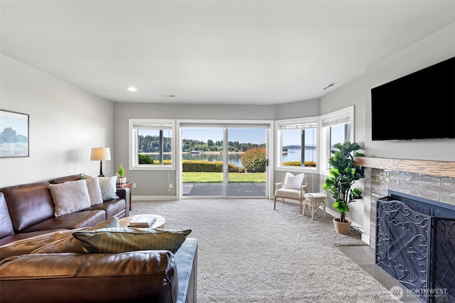 52 Chapman Loop Unit D, Steilacoom, WA 98388 - carpeted living area featuring baseboards, a fireplace with flush hearth, and recessed lighting
