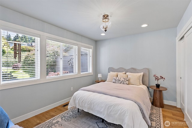 52 Chapman Loop Unit D, Steilacoom, WA 98388 - bedroom featuring light wood-type flooring, baseboards, recessed lighting, and a closet
