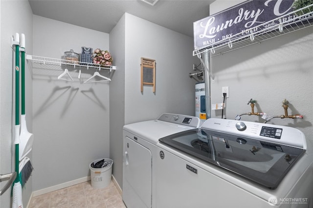 5822 N 35th St Unit C9, Tacoma, WA 98407 - washroom featuring washer and clothes dryer and baseboards