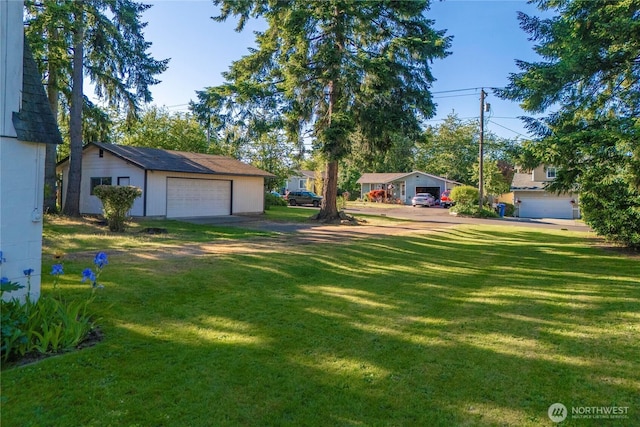 1416 S 88th St, Tacoma, WA 98444 - view of grassy yard with a garage and an outdoor structure