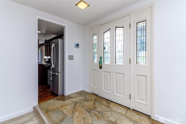 32622 39th Ave SW, Federal Way, WA 98023 - entrance foyer with baseboards and light stone finish flooring