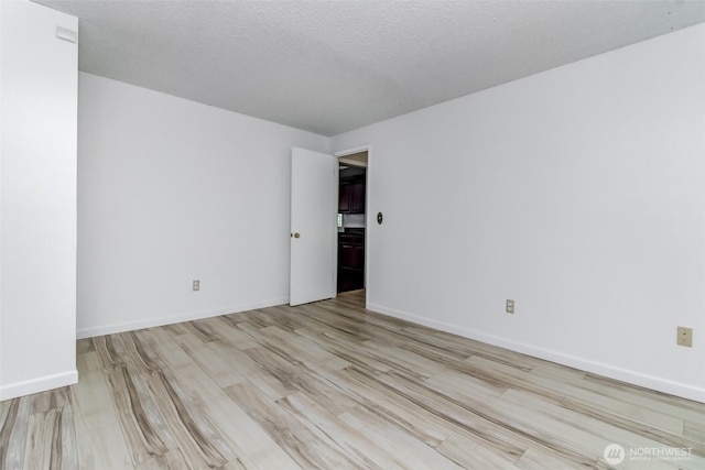 32622 39th Ave SW, Federal Way, WA 98023 - unfurnished room featuring wood finished floors and baseboards