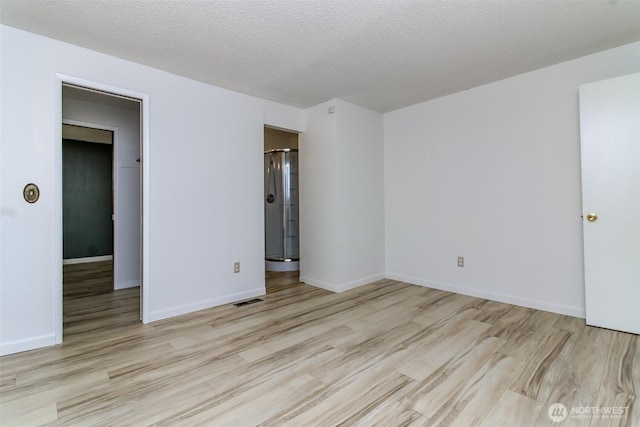 32622 39th Ave SW, Federal Way, WA 98023 - spare room with wood finished floors, baseboards, and a textured ceiling