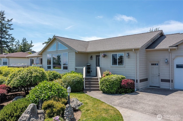 1257 Canterbury Ln, Oak Harbor, WA 98277 - view of front facade with roof with shingles and a garage
