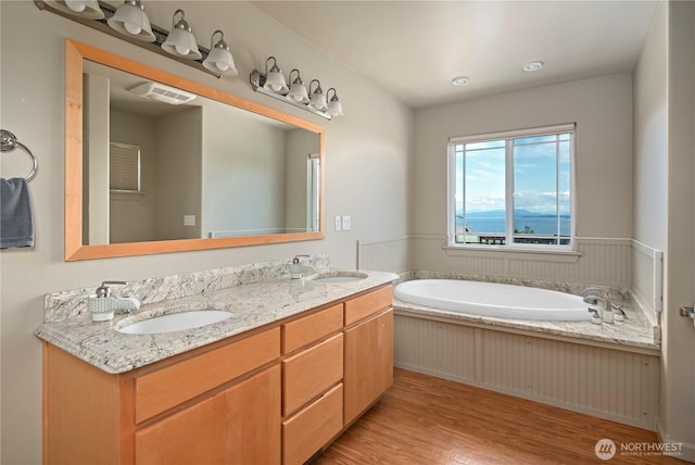 1257 Canterbury Ln, Oak Harbor, WA 98277 - full bath featuring wood finished floors, double vanity, and a garden tub