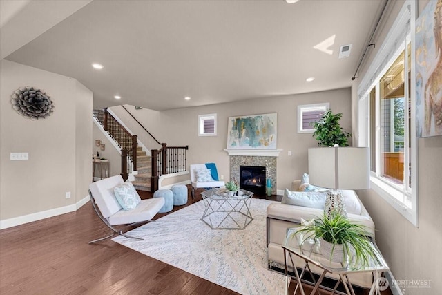 17518 39th Ave SE, Bothell, WA 98012 - living room with wood finished floors, stairway, a glass covered fireplace, baseboards, and recessed lighting