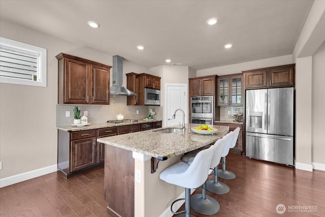 17518 39th Ave SE, Bothell, WA 98012 - kitchen with appliances with stainless steel finishes, wall chimney range hood, a sink, baseboards, and dark wood-style floors