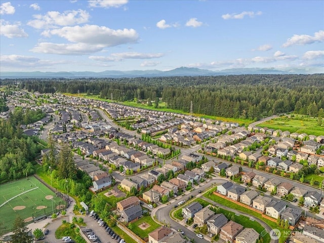 17518 39th Ave SE, Bothell, WA 98012 - aerial view of property's location featuring a forest, nearby suburban area, and a mountainous background