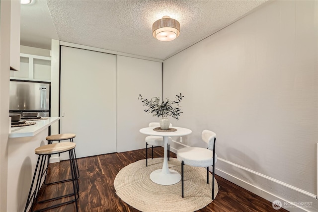 6268 137th Pl NE Unit 244, Redmond, WA 98052 - sitting room featuring a textured ceiling and dark wood-style flooring