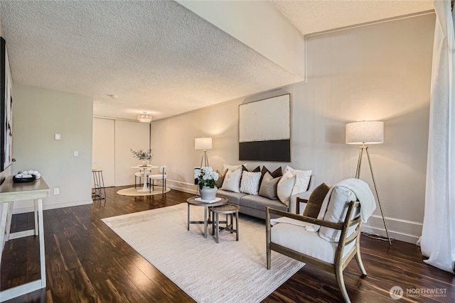 6268 137th Pl NE Unit 244, Redmond, WA 98052 - living area featuring wood finished floors, a textured ceiling, and baseboards