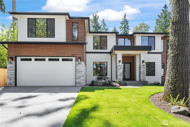 14511 SE 21st Pl, Bellevue, WA 98007 - contemporary house with an attached garage, stone siding, and concrete driveway