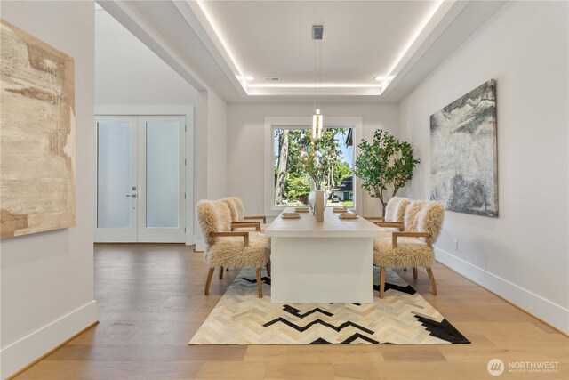 14511 SE 21st Pl, Bellevue, WA 98007 - sitting room with a tray ceiling, light wood-type flooring, baseboards, and french doors