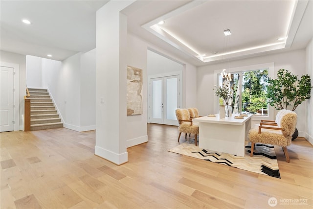 14511 SE 21st Pl, Bellevue, WA 98007 - living room with a raised ceiling, light wood-type flooring, recessed lighting, baseboards, and stairway