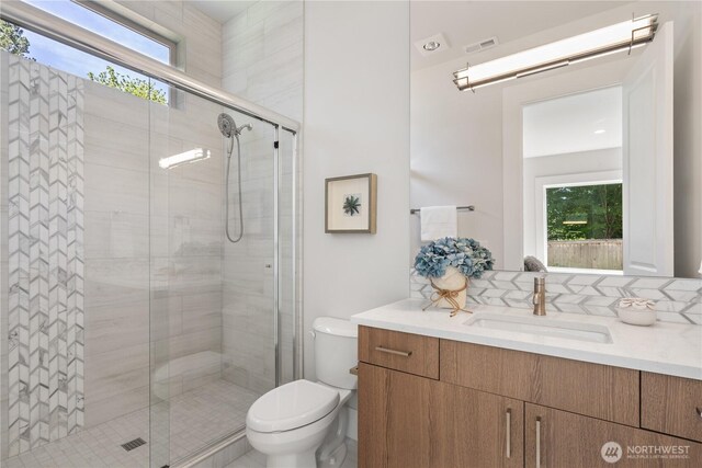 14511 SE 21st Pl, Bellevue, WA 98007 - full bathroom with healthy amount of natural light, vanity, toilet, and a stall shower