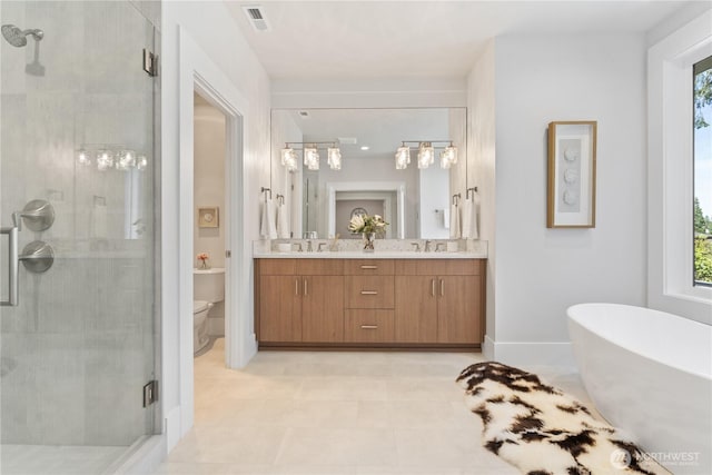 14511 SE 21st Pl, Bellevue, WA 98007 - full bath featuring a shower stall, double vanity, a freestanding bath, and toilet