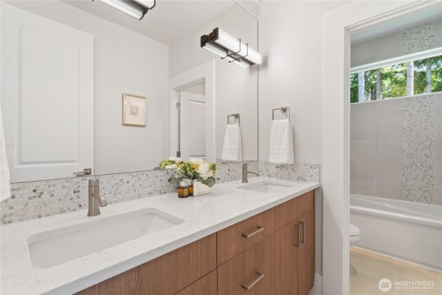 14511 SE 21st Pl, Bellevue, WA 98007 - bathroom featuring toilet, double vanity, tile patterned flooring, and shower / bathtub combination